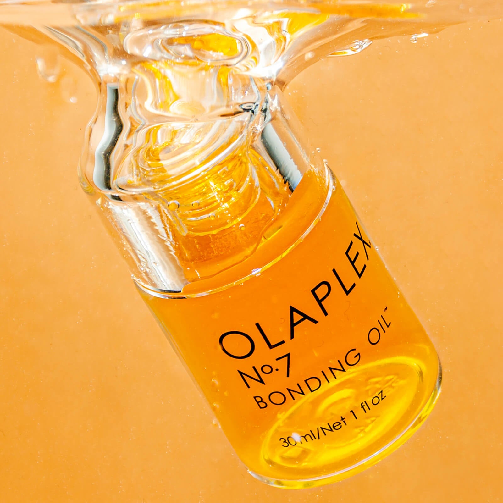 Grace Beauty Olaplex No.7 Bonding Oil 30ml for hair repair and shine, featuring a sleek brown bottle with dropper applicator