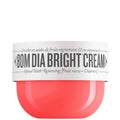 Bottle of Sol de Janeiro Bom Dia Bright Cream moisturizer by Grace Beauty, showcasing bright yellow packaging and pump dispenser.