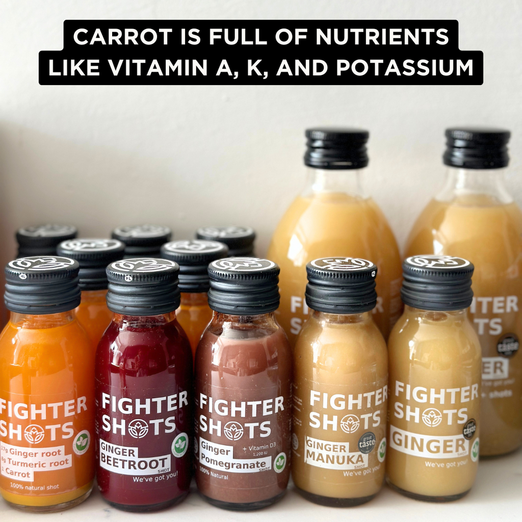 Fighter Shots vegan wellness shot with carrot, ginger, and turmeric in a 60ml cold-pressed bottle, shown with a glass of shot.