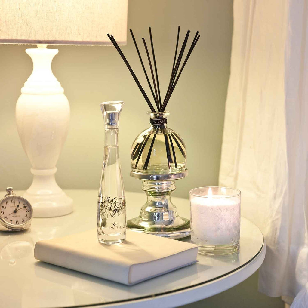 Pairfum London The Snow Crystal Candle in pink lavender scent, 200g, with elegant packaging and a lit wick.