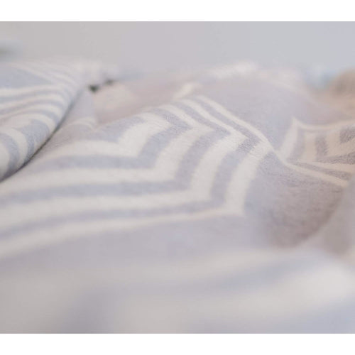 Gray Atlanta blanket by Grace Beauty, a cozy single-sized throw blanket suitable for beds and relaxation.
