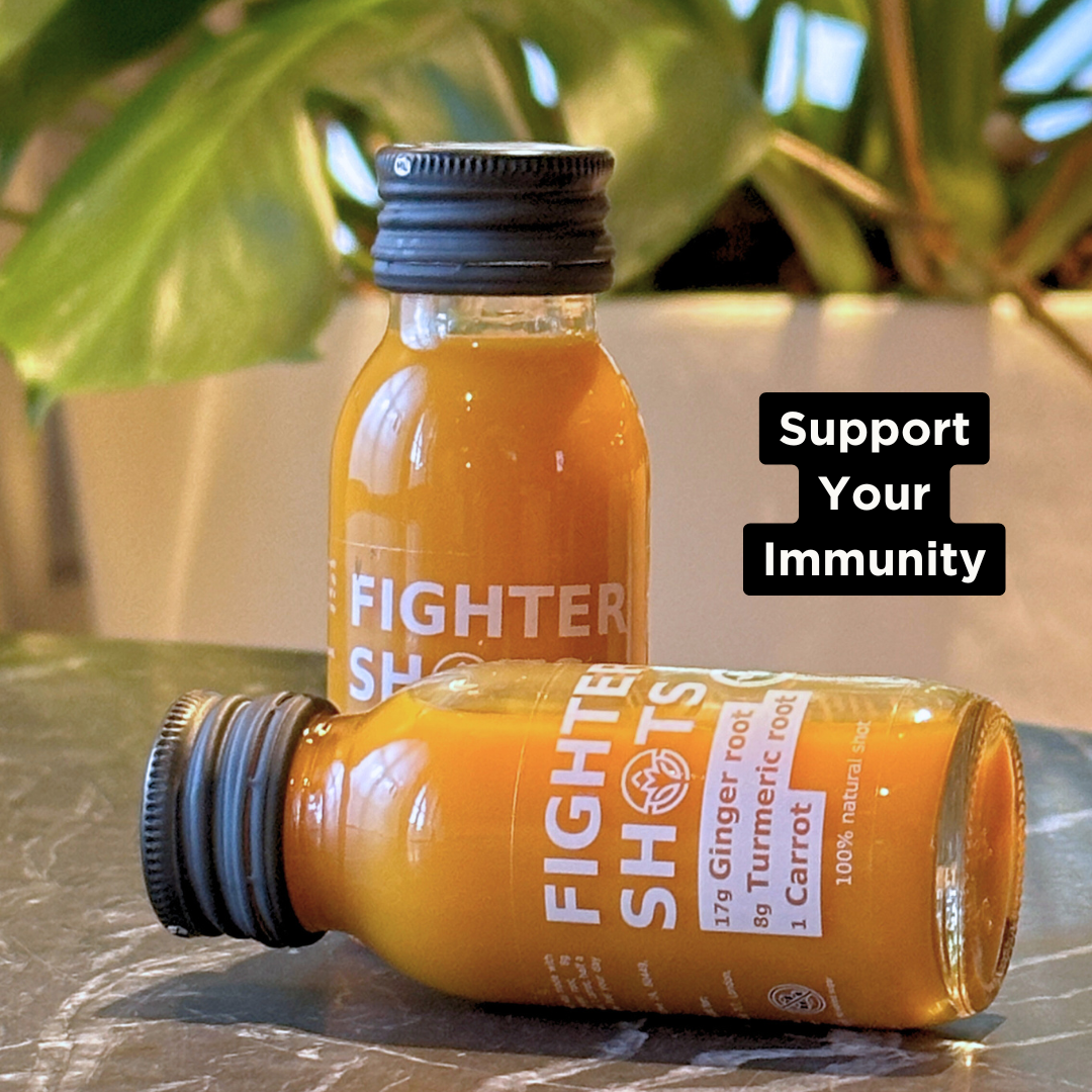 Fighter Shots vegan wellness shot with carrot, ginger, and turmeric in a 60ml cold-pressed bottle, single or 12-pack.