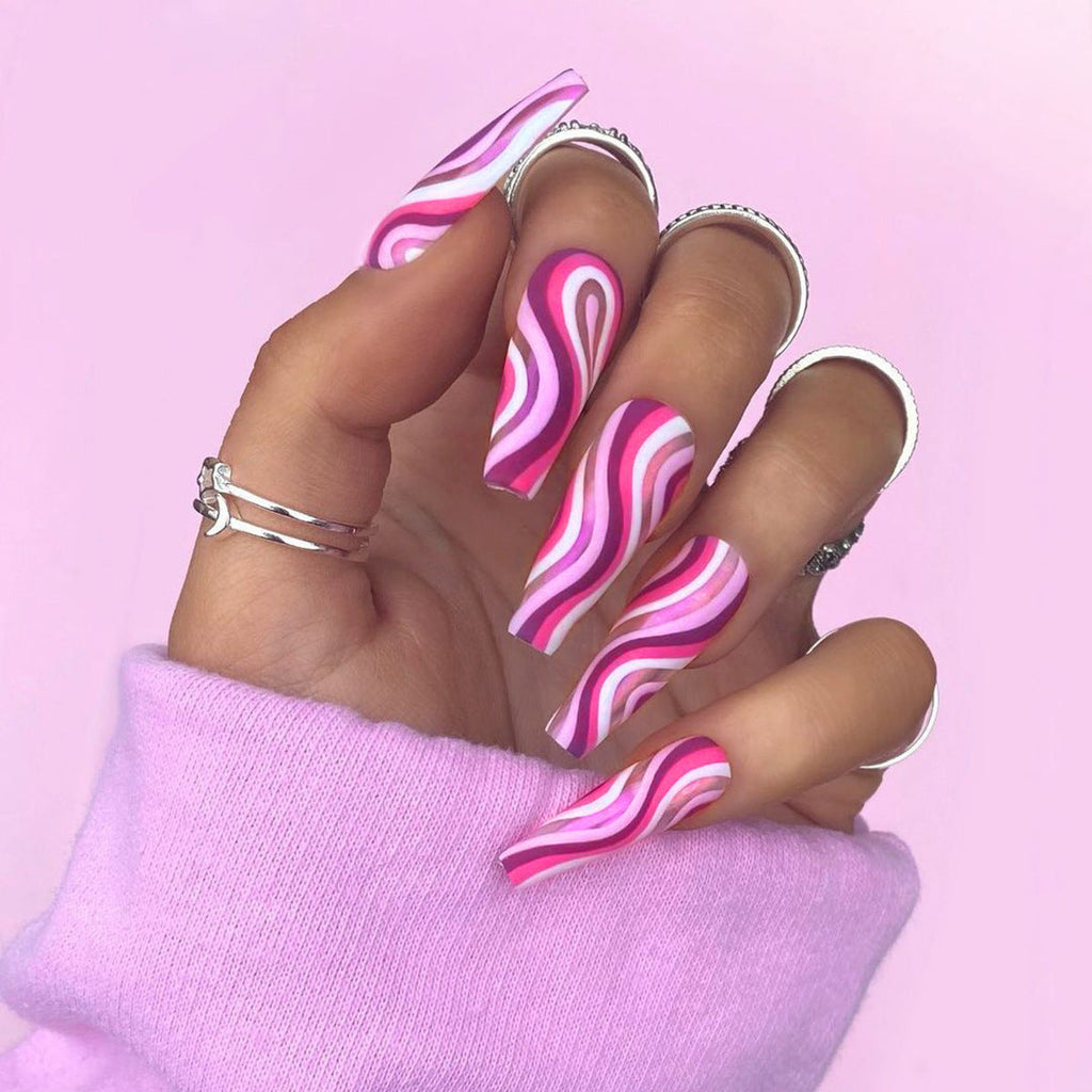 Decorative detachable artistic fake nails with colorful designs, designed for a fashionable, wearable nail look by Cashymart.