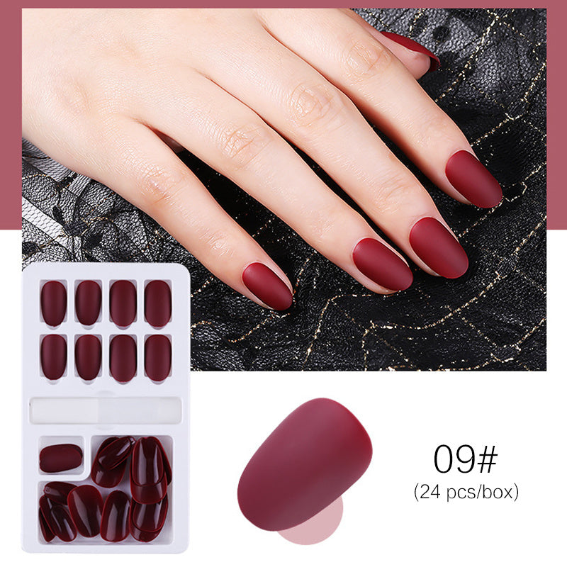 Reusable stick-on nails from Cashymart displayed on a white background, showcasing their natural shape and glossy finish.