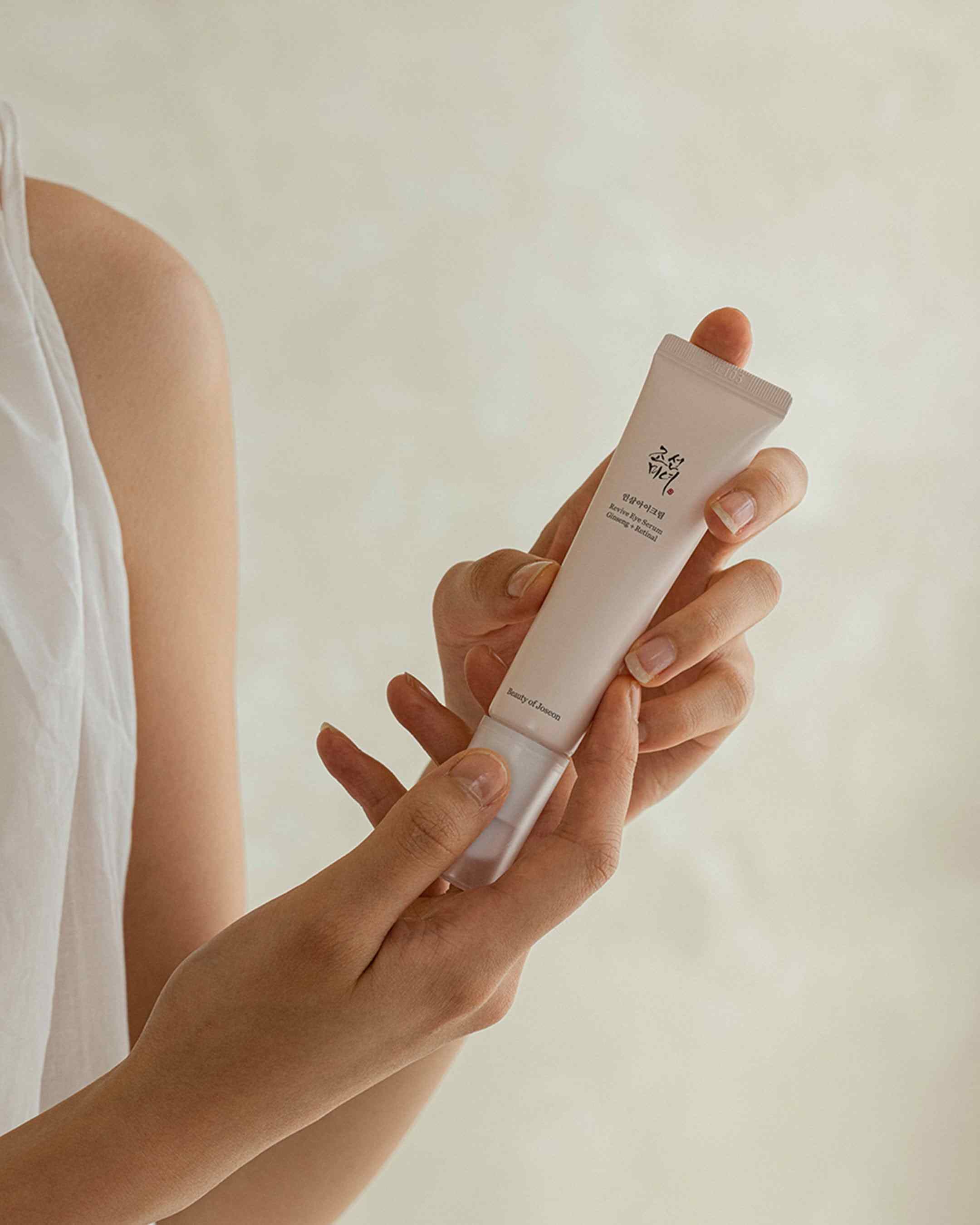Beauty of Joseon Revive Eye Serum with ginseng and retinal in a 30ml bottle, showing the eye cream packaging and applicator.